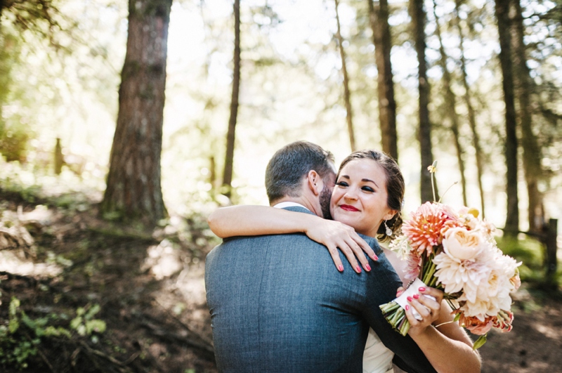 First look in a forest in Oregon wedding