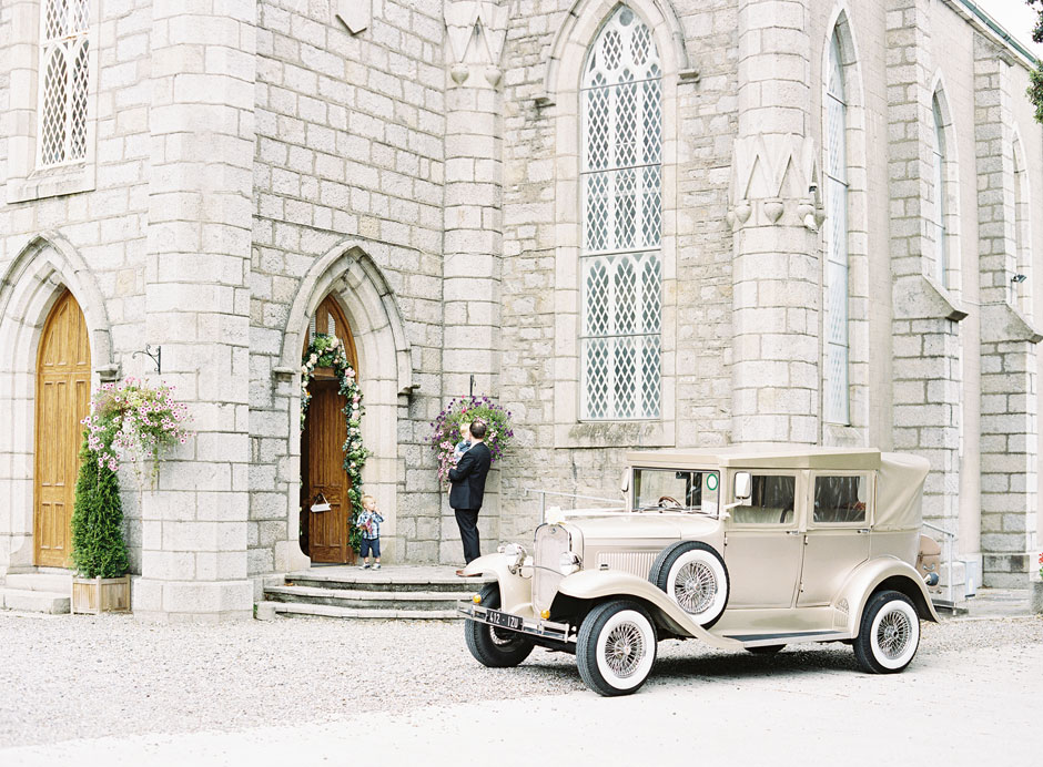 Ford Model A wedding car in front of Crinken Church Ireland