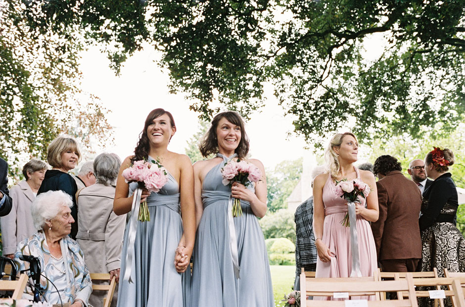 Two Birds Bridesmaids in pale blue at an outside ceremony at Barnsley House