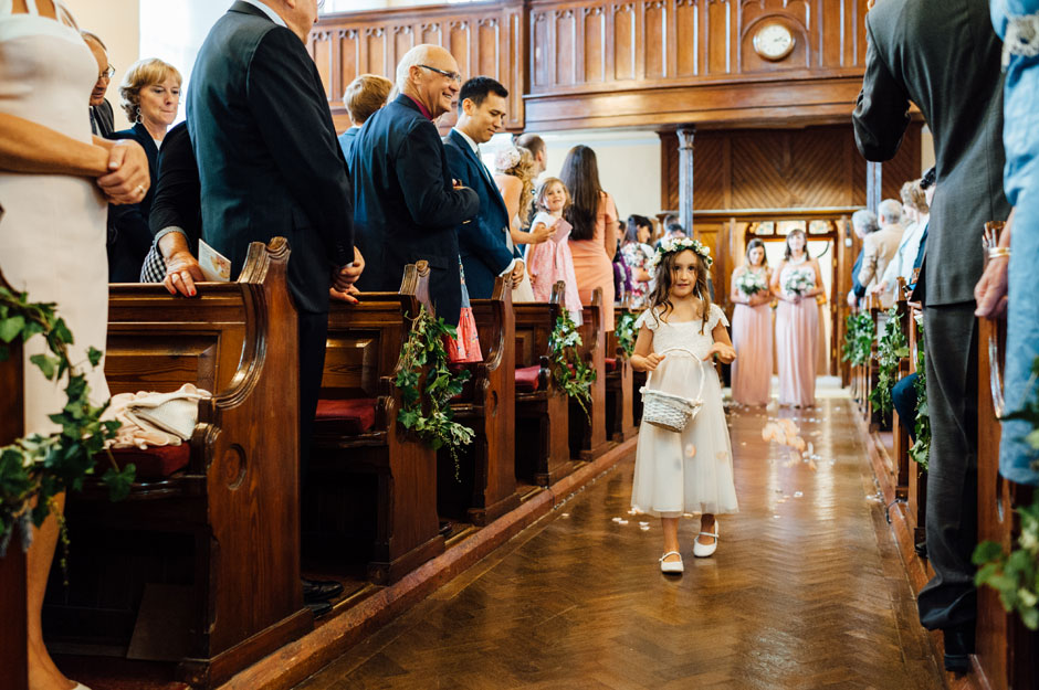 Flowergirl walking into Crinken Church in bray for an Irish wedding